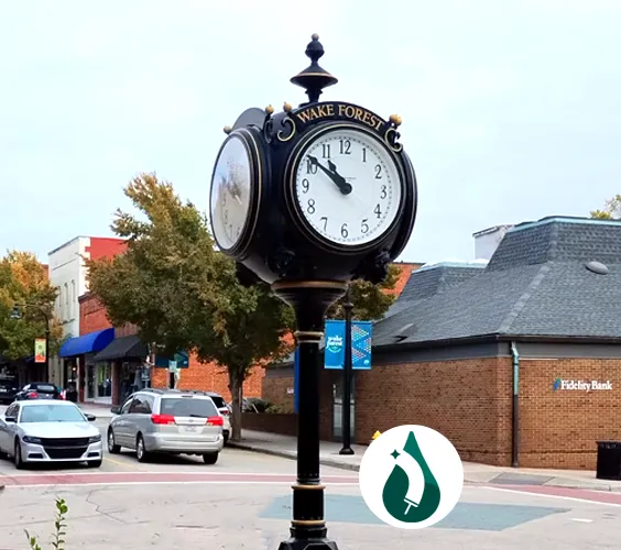 Allied Cleaners founders in downtown Wake Forest Marisol and Yasser, founders of Allied Cleaners, standing in downtown Wake Forest, NC